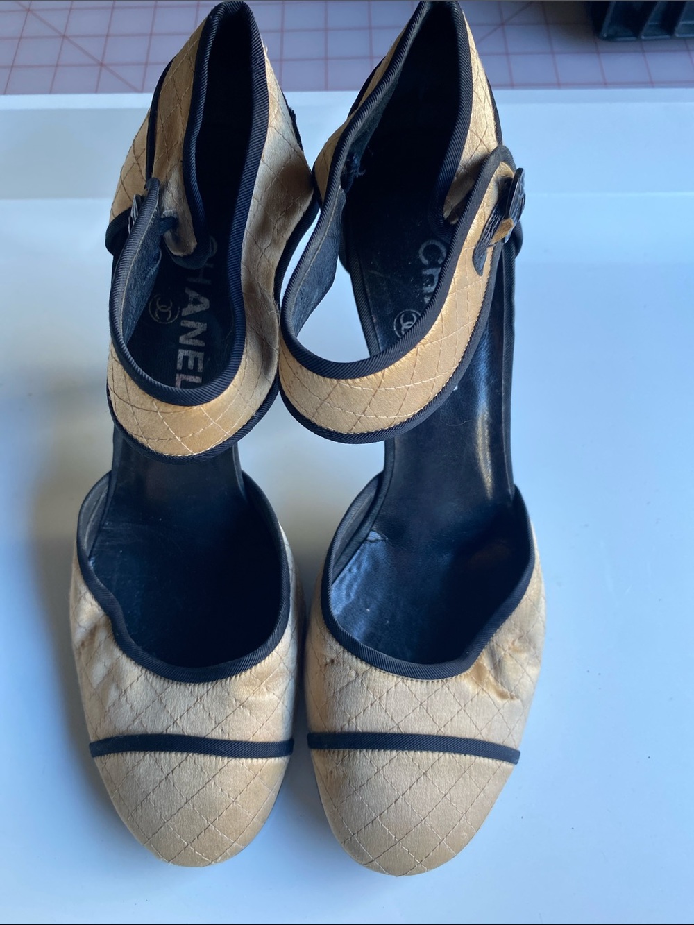CHANEL Beige Quilted Ankle-Strap Pumps with Black Trim